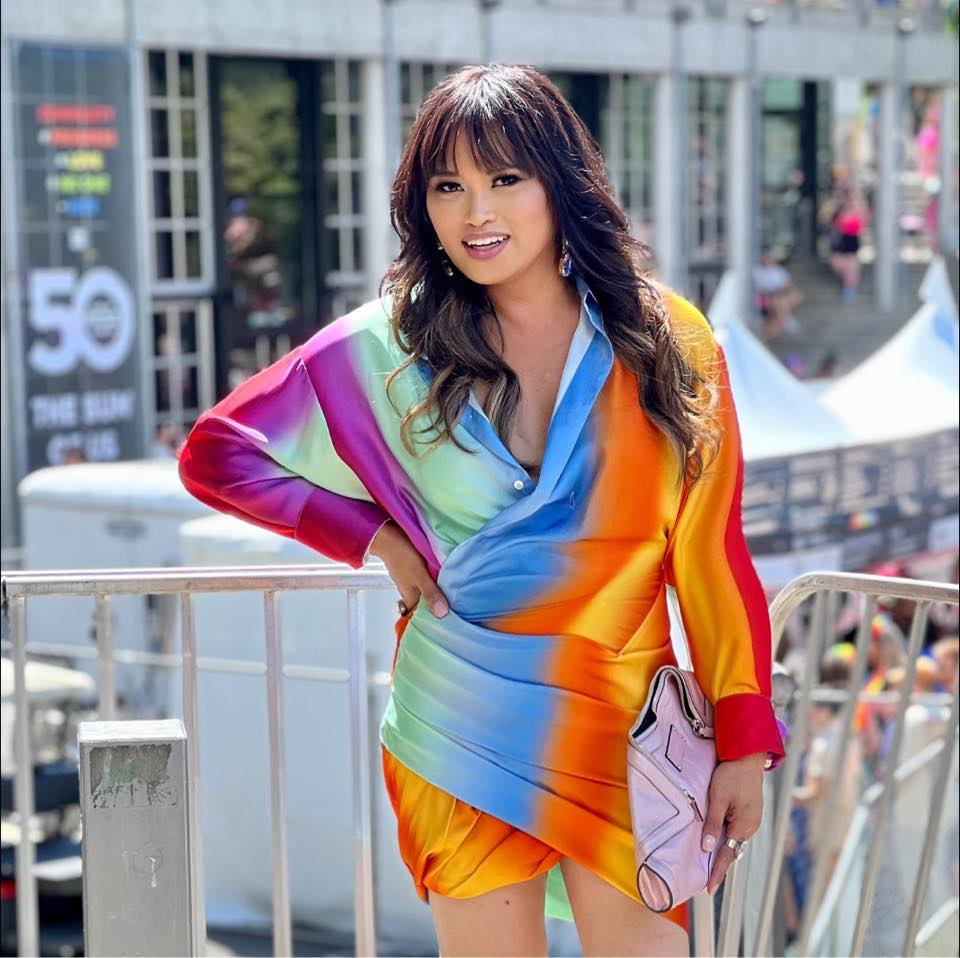 Gaysha Starr wearing a colorful rainbow outfit